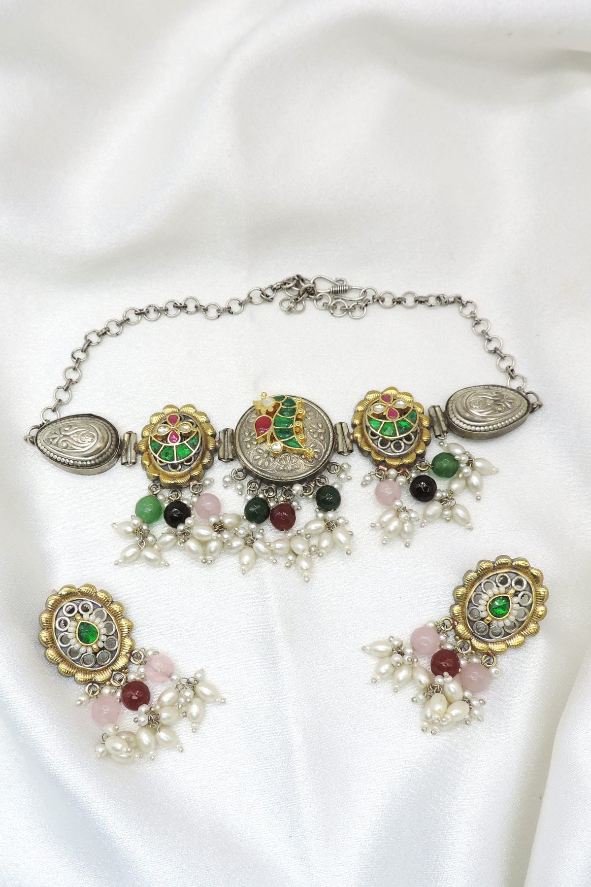 Oxidized dual-tone multicolor meenakari necklace set with pearl detailing and matching earrings by joyrias