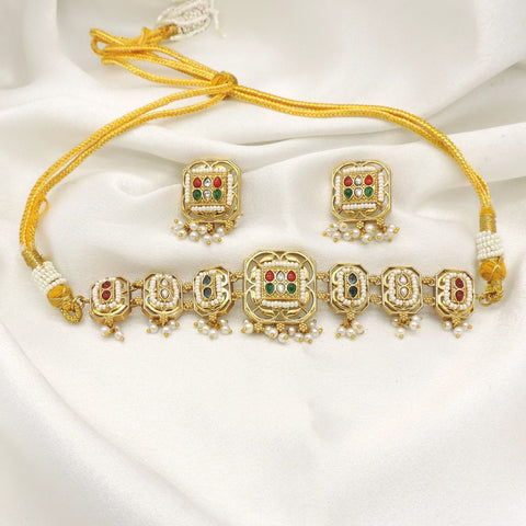 Gold-toned multicolor Kundan panel necklace set with pearl drops and matching earrings by joyrias