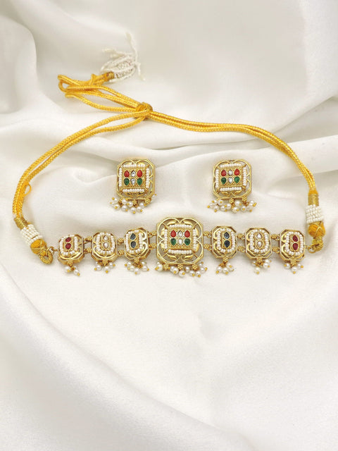 Gold-toned multicolor Kundan panel necklace set with pearl drops and matching earrings by joyrias