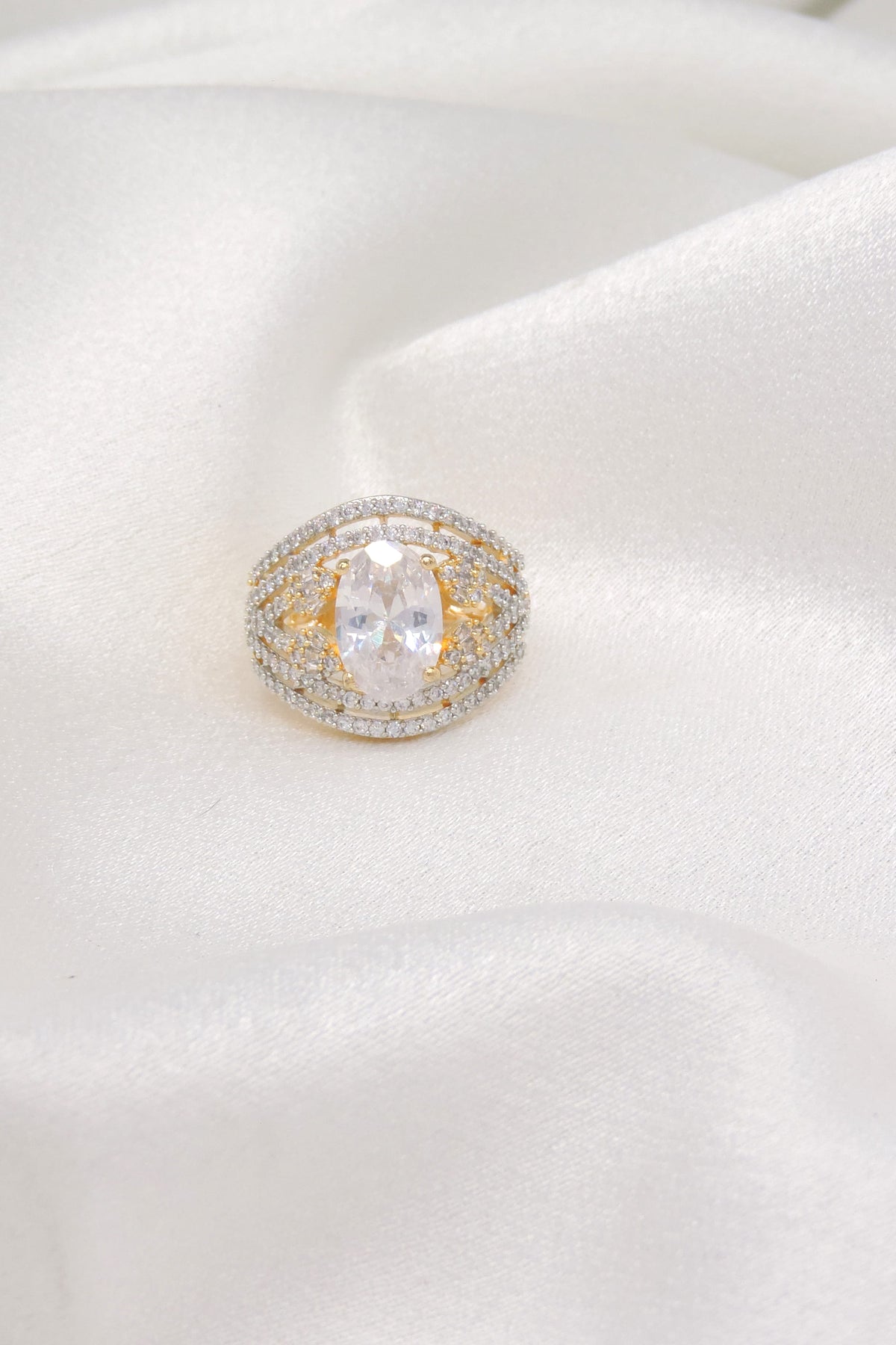 Clear AD CZ ring with gold-toned detailing by joyrias