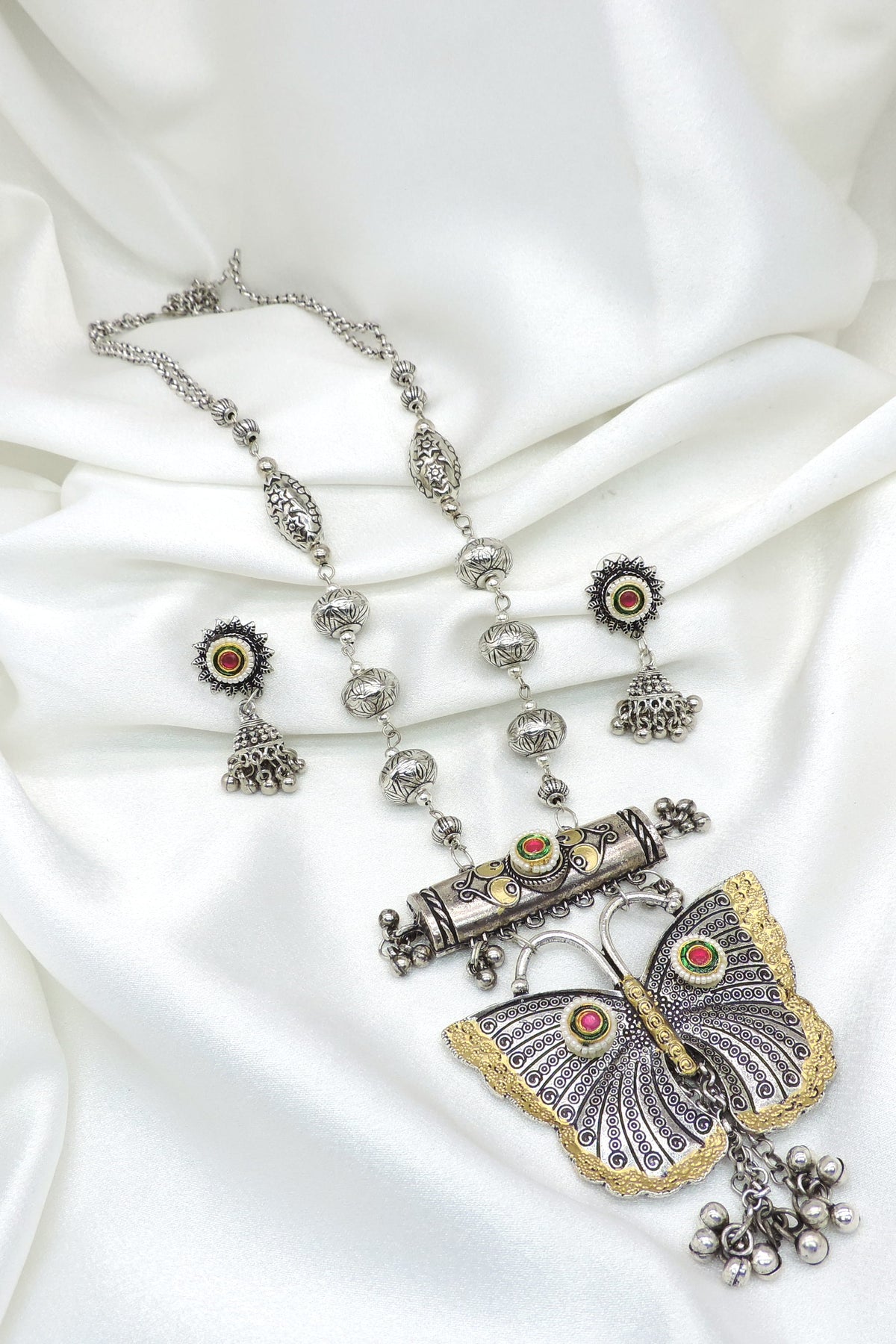 Oxidized silver butterfly long necklace set with matching earrings and pearl detailing by joyrias