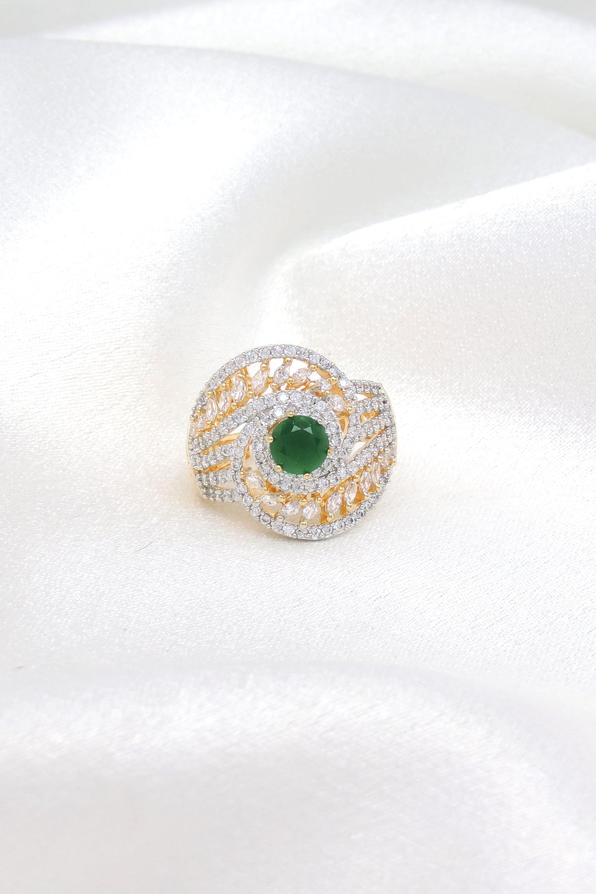 Graceful CZ green center ring with gold-toned detailing by joyrias