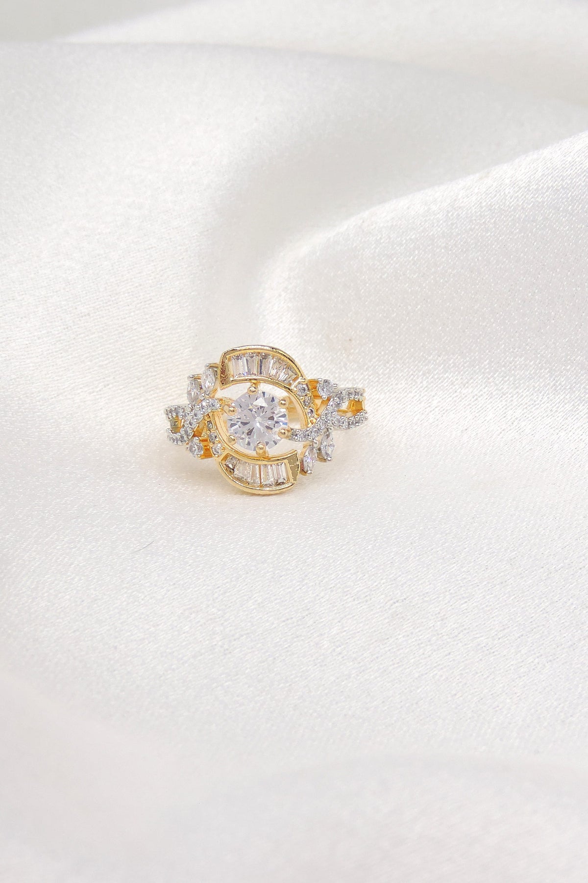 Ornate dual-tone stone ring with baguette detailing and sparkling accents by joyrias