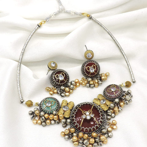 Oxidized dual-tone meenakari pearl necklace set with maroon and green detailing and matching earrings by joyrias