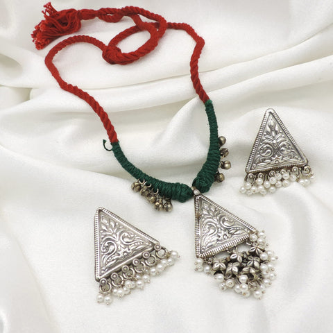 Oxidized triangular floral pearl necklace set with colorful threadwork and matching earrings by joyrias