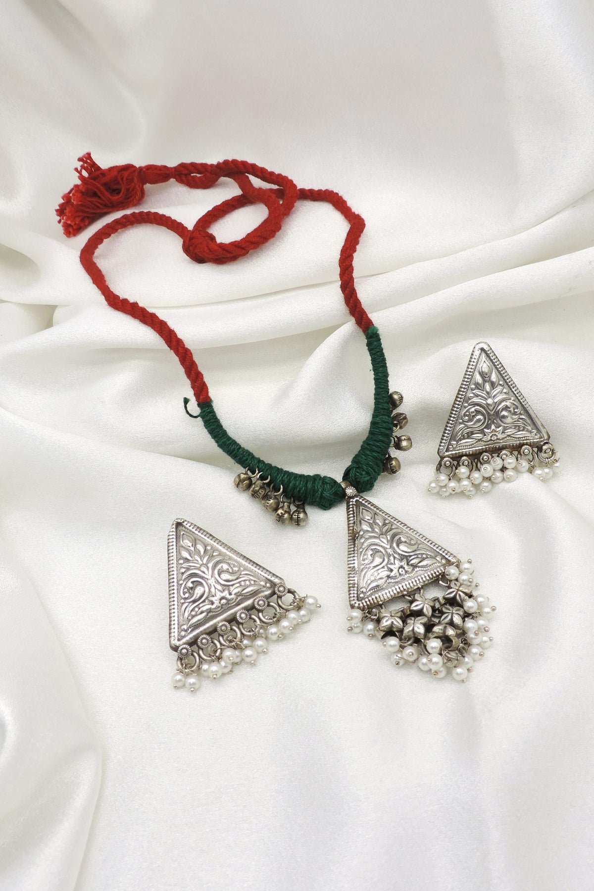 Oxidized triangular floral pearl necklace set with colorful threadwork and matching earrings by joyrias