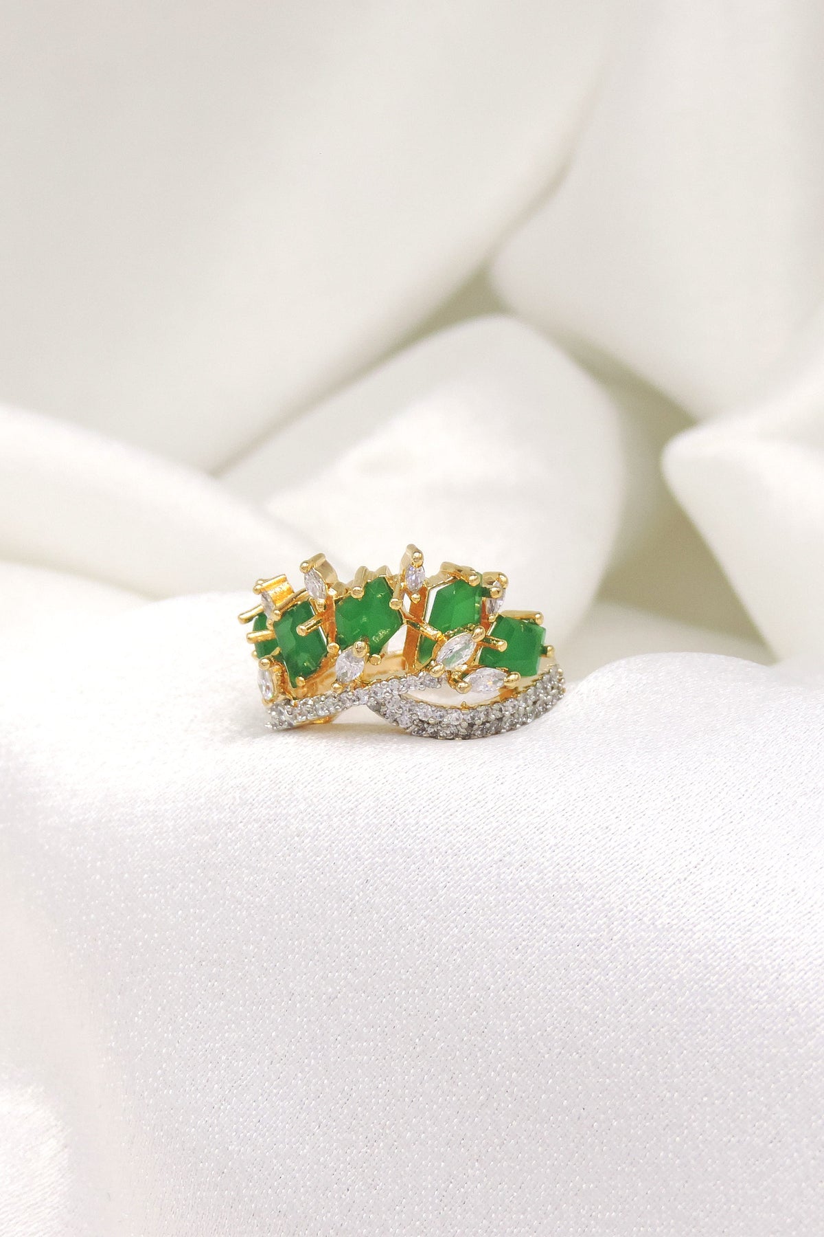 Regal green stone CZ ring with gold-toned detailing by joyrias