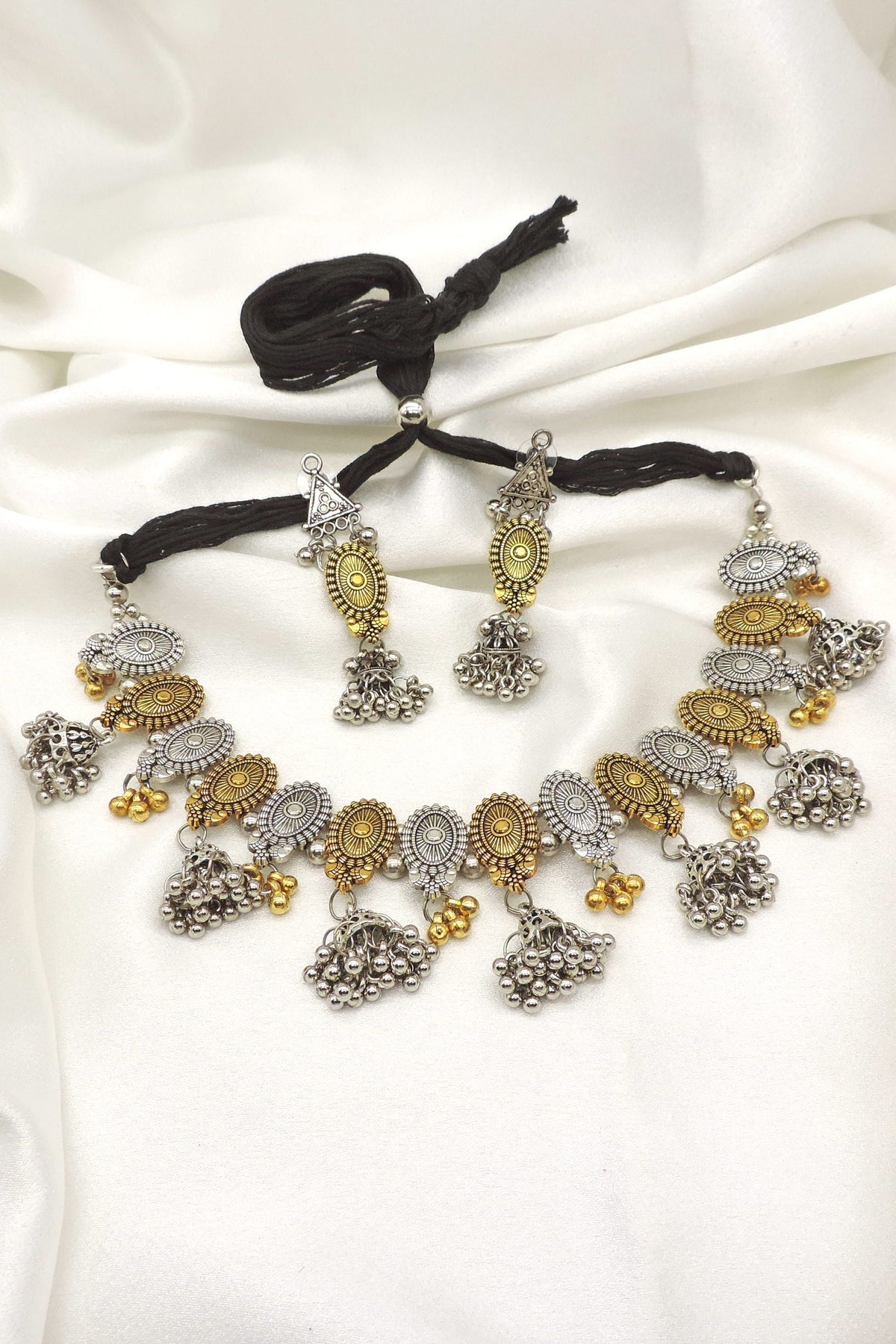 Oxidized dual-tone floral pearl choker set with matching earrings by Joyrias
