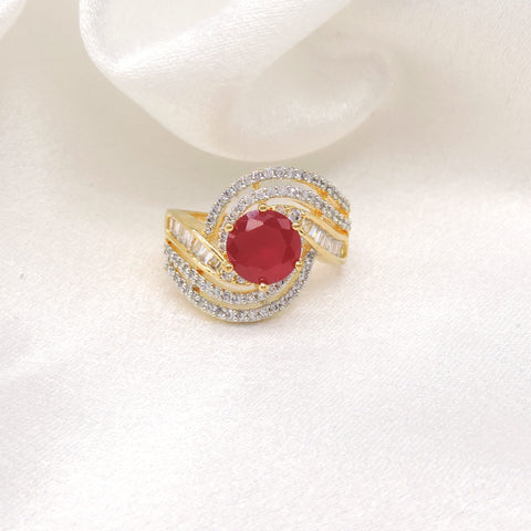 Crimson red stone CZ swirled ring with gold-toned detailing by joyrias