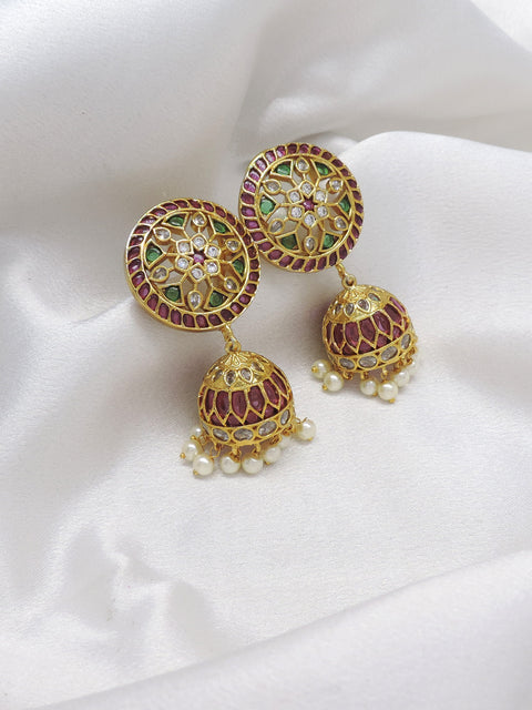 Kundan meenakari pink green pearl jhumka earrings with traditional detailing by joyrias
