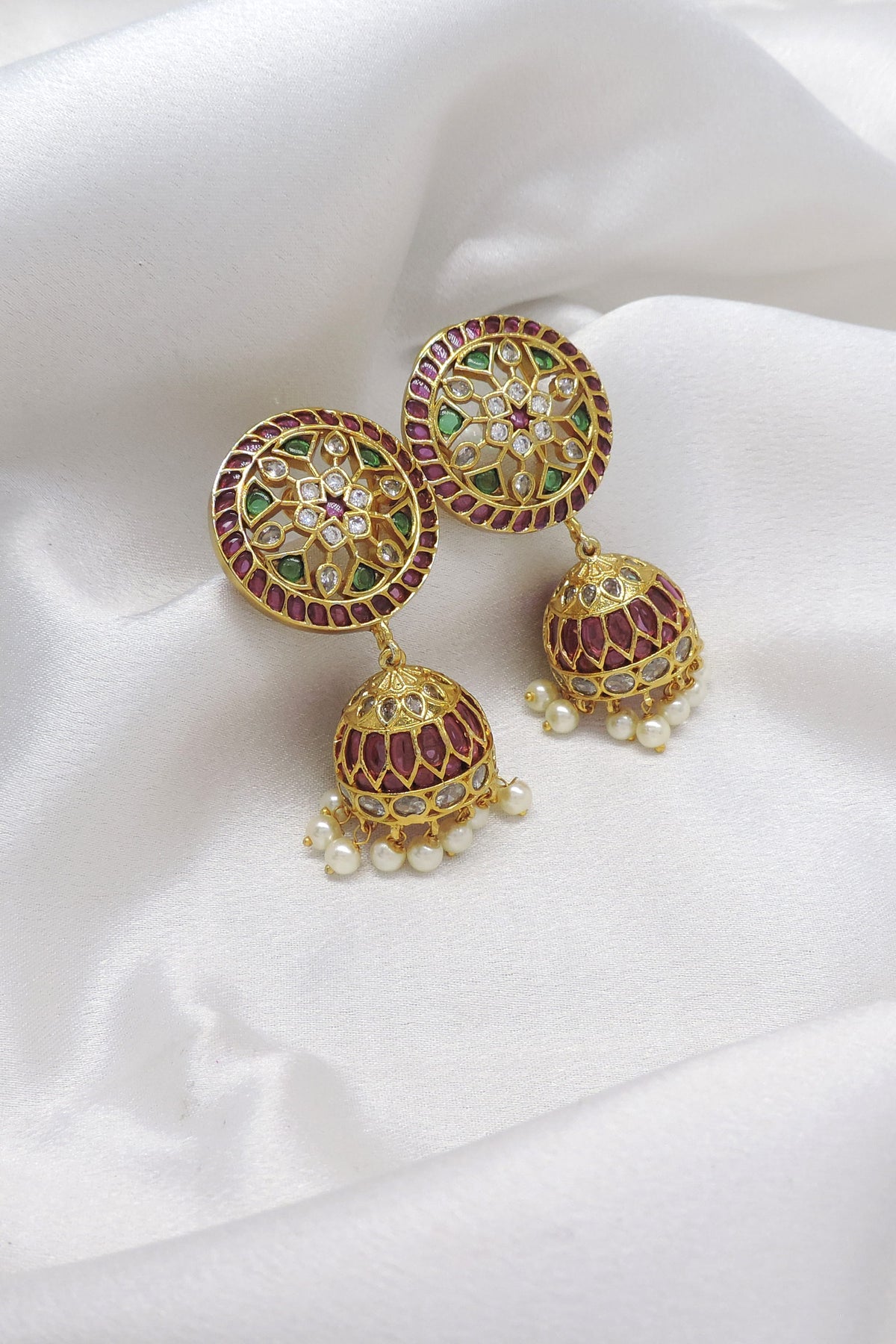 Kundan meenakari pink green pearl jhumka earrings with traditional detailing by joyrias