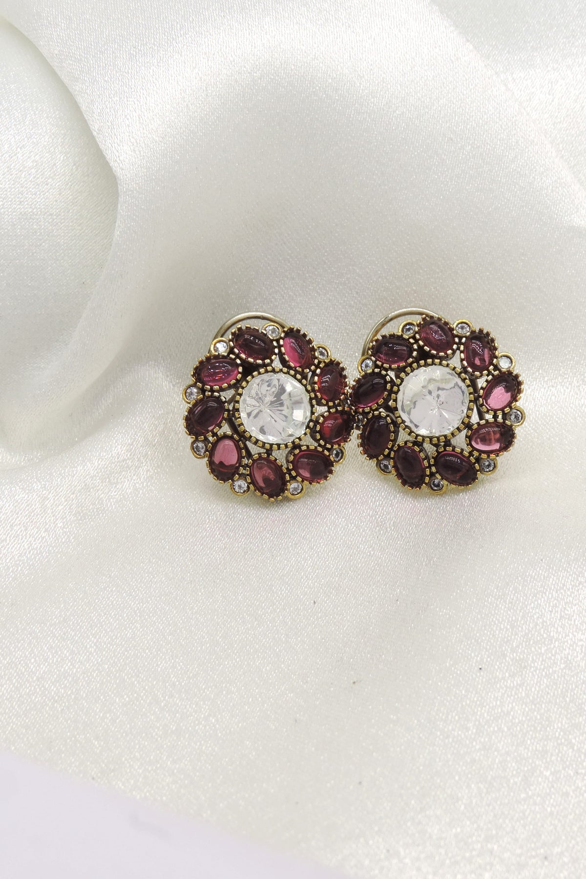 Burgundy stone floral stud earrings by Joyrias