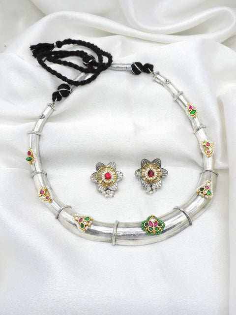 Oxidized dual-tone floral Meenakari necklace set with green pink accents and matching earrings by joyrias