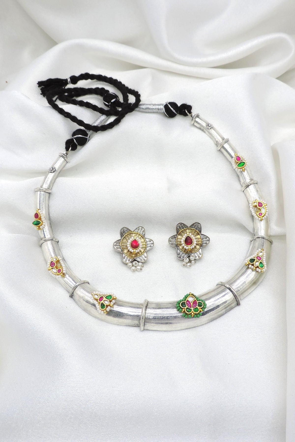 Oxidized dual-tone floral Meenakari necklace set with green pink accents and matching earrings by joyrias