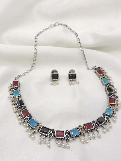 Oxidized dual-tone multicolor rectangular stone necklace set with matching earrings and pearl detailing by joyrias
