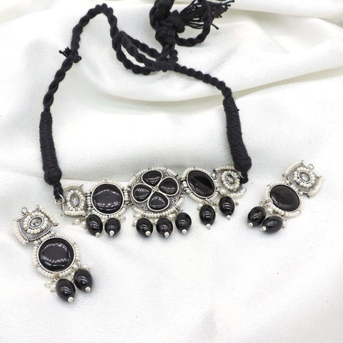 Oxidized black stone floral pearl necklace set with black bead accents and matching earrings by joyrias