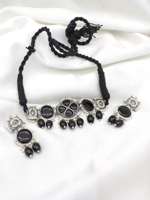 Oxidized black stone floral pearl necklace set with black bead accents and matching earrings by joyrias