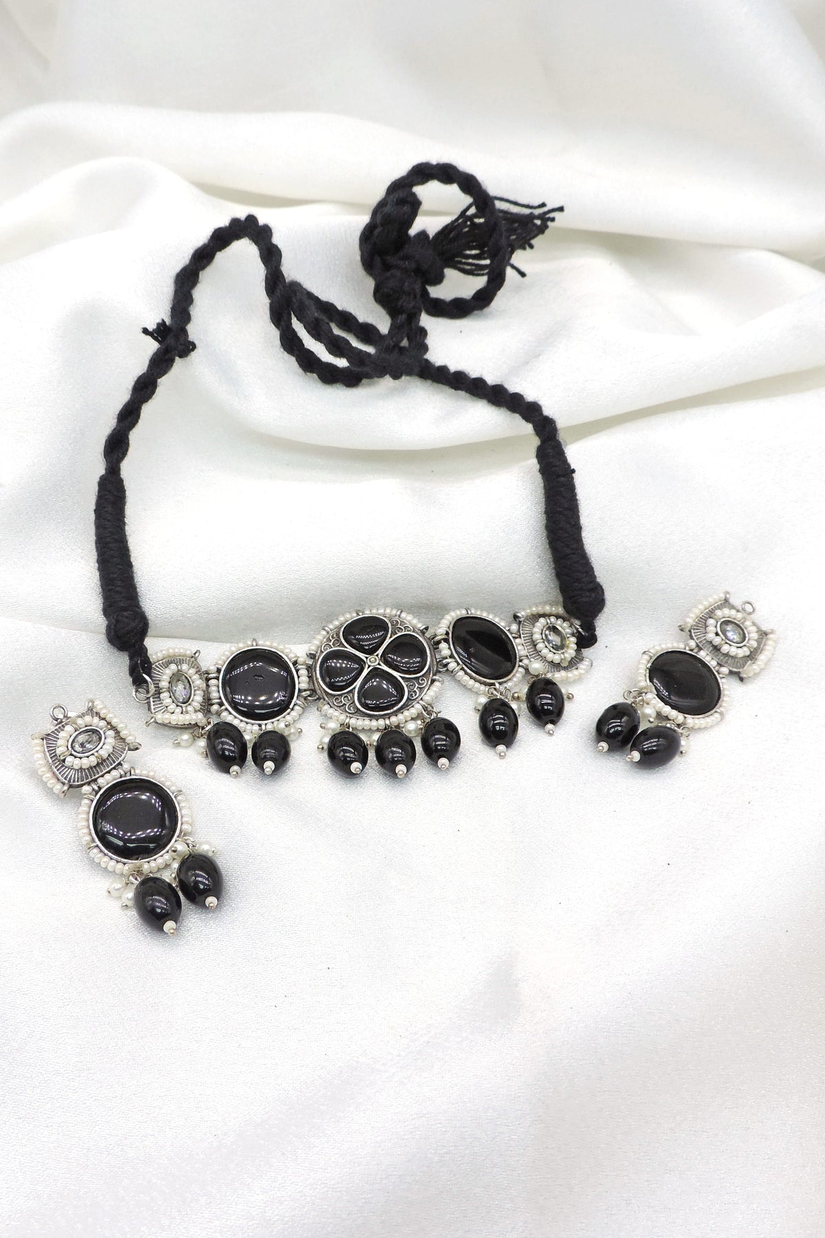 Oxidized black stone floral pearl necklace set with black bead accents and matching earrings by joyrias