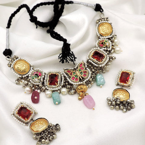 Oxidized multicolor kundan necklace set with pearl detailing and matching earrings by Joyrias