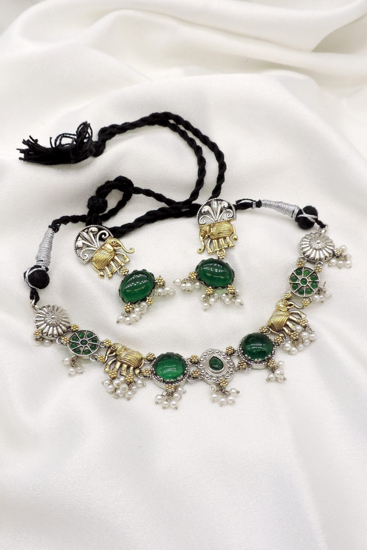 Oxidized elephant green stone pearl necklace set with antique silver-gold detailing and matching earrings by joyrias
