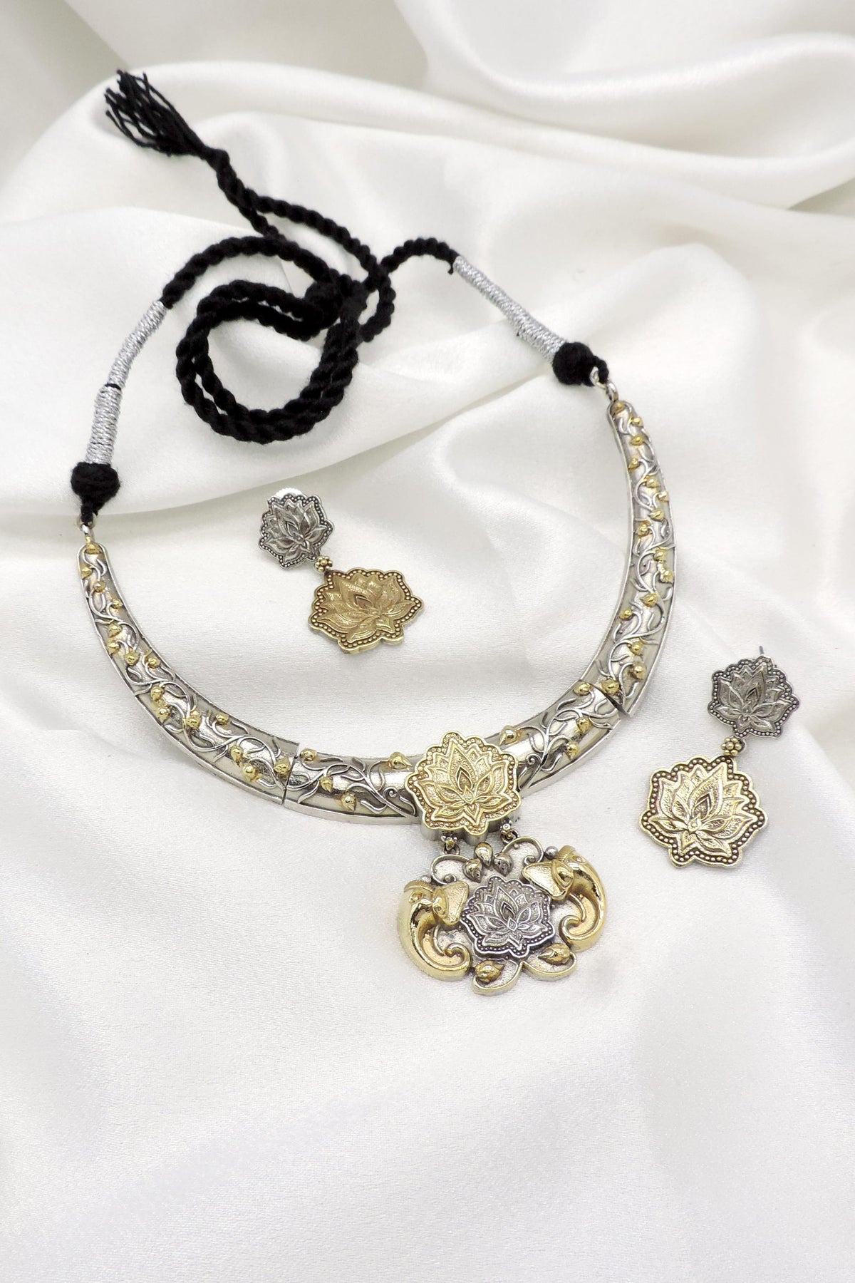Oxidized dual-tone lotus floral necklace set with matching earrings by joyrias