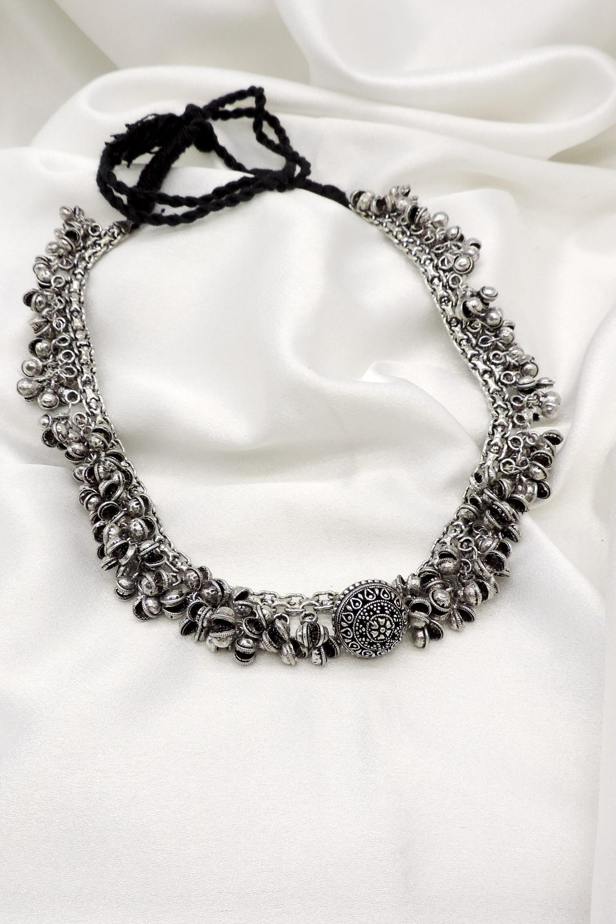 Oxidized silver ghungroo coin necklace with engraved centerpiece by joyrias