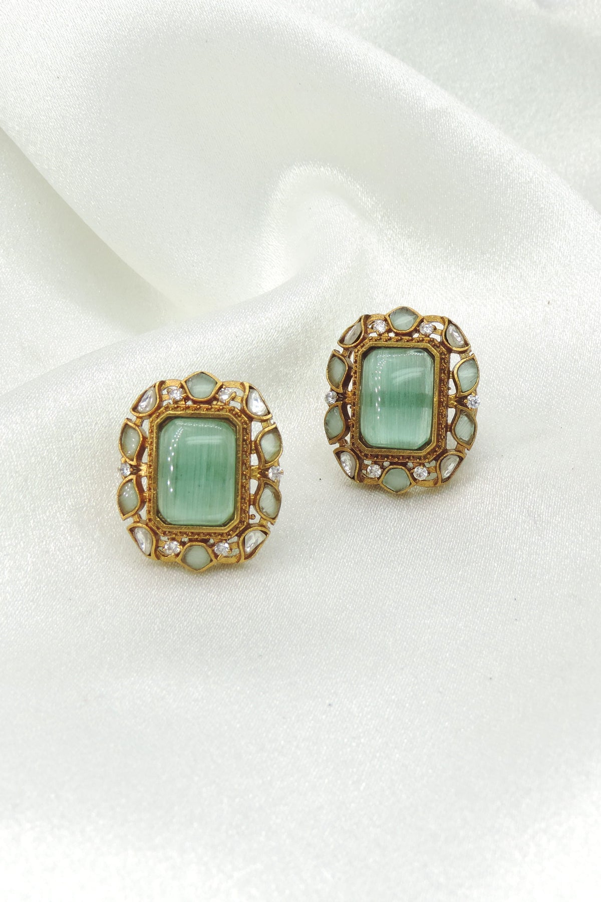Mint Green Cat Eye Stud Earrings by Joyrias