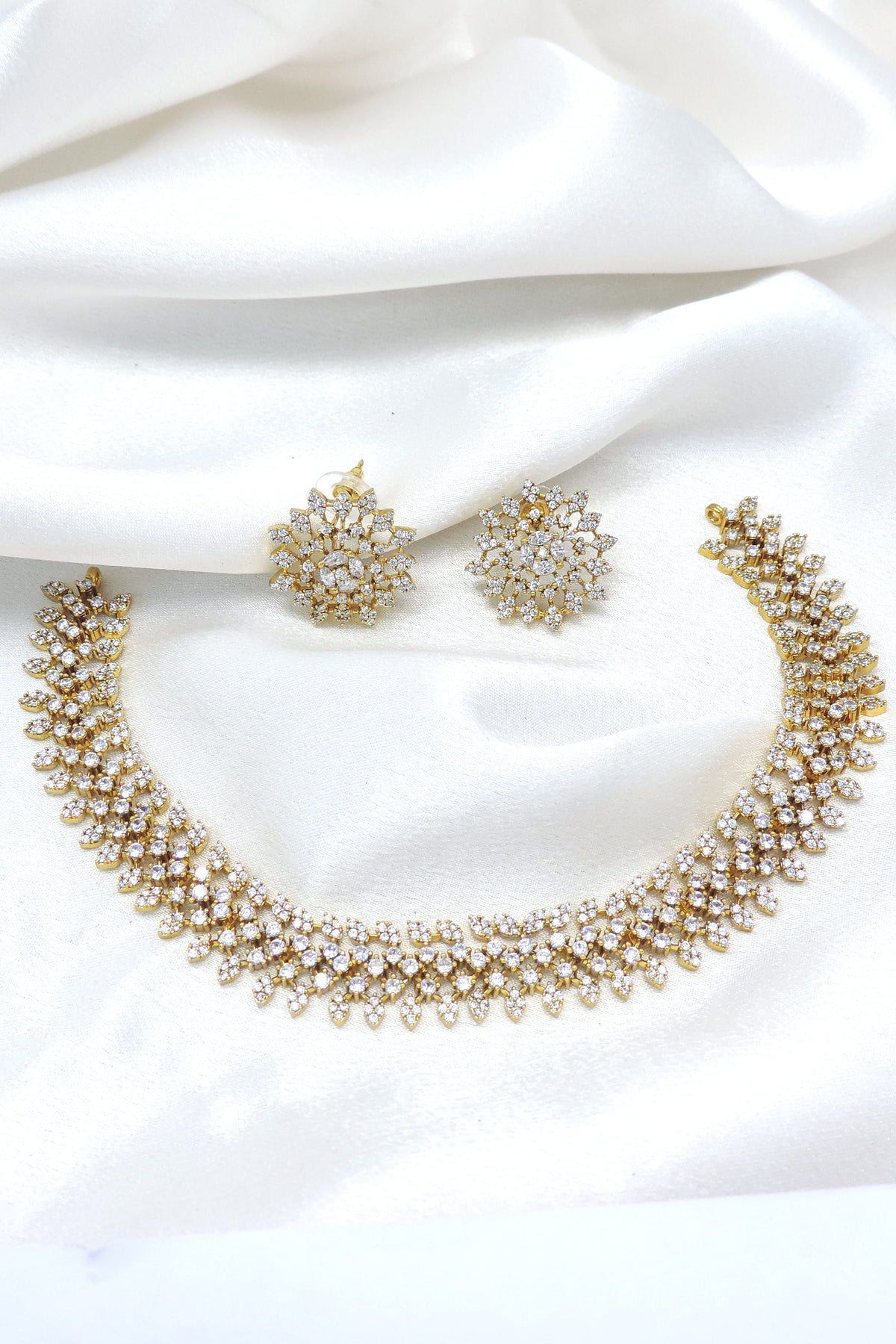 Gold-toned floral CZ necklace set with matching earrings by joyrias