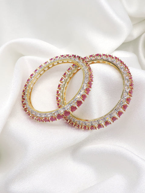 Regal gold-toned pink stone AD bangle set with sparkling detailing by joyrias