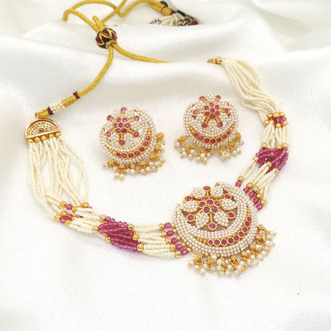 Graceful pearl and pink bead imitation choker set with faux pearls, pink accent stones, CZ accents, and matching earrings