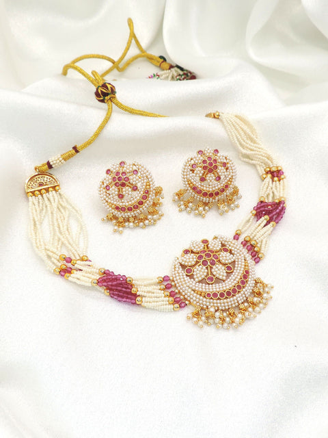 Graceful pearl and pink bead imitation choker set with faux pearls, pink accent stones, CZ accents, and matching earrings