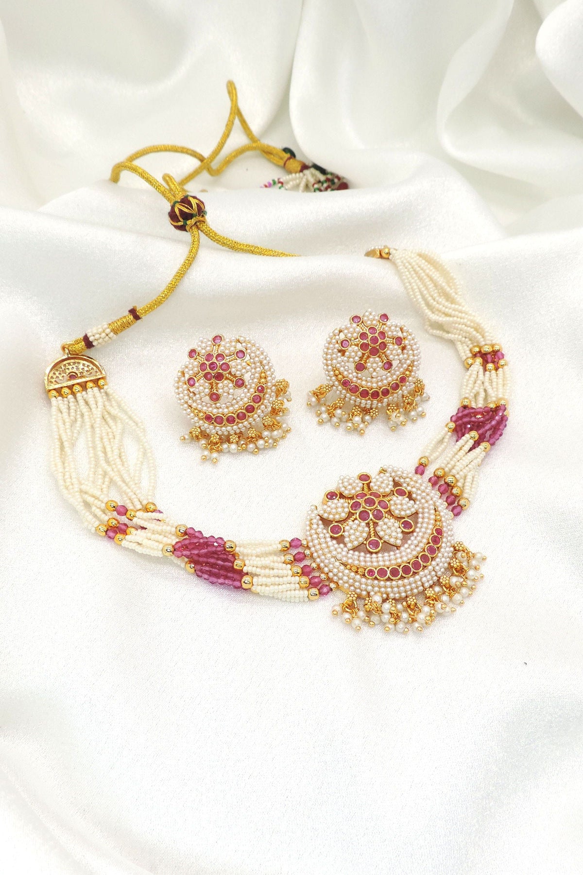Graceful pearl and pink bead imitation choker set with faux pearls, pink accent stones, CZ accents, and matching earrings