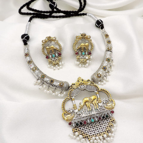 Oxidized dual-tone elephant pearl hasli necklace set with colorful stones and matching earrings by joyrias