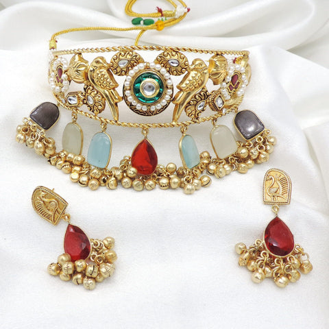 Gold-toned peacock stone pearl choker set with matching earrings by Joyrias