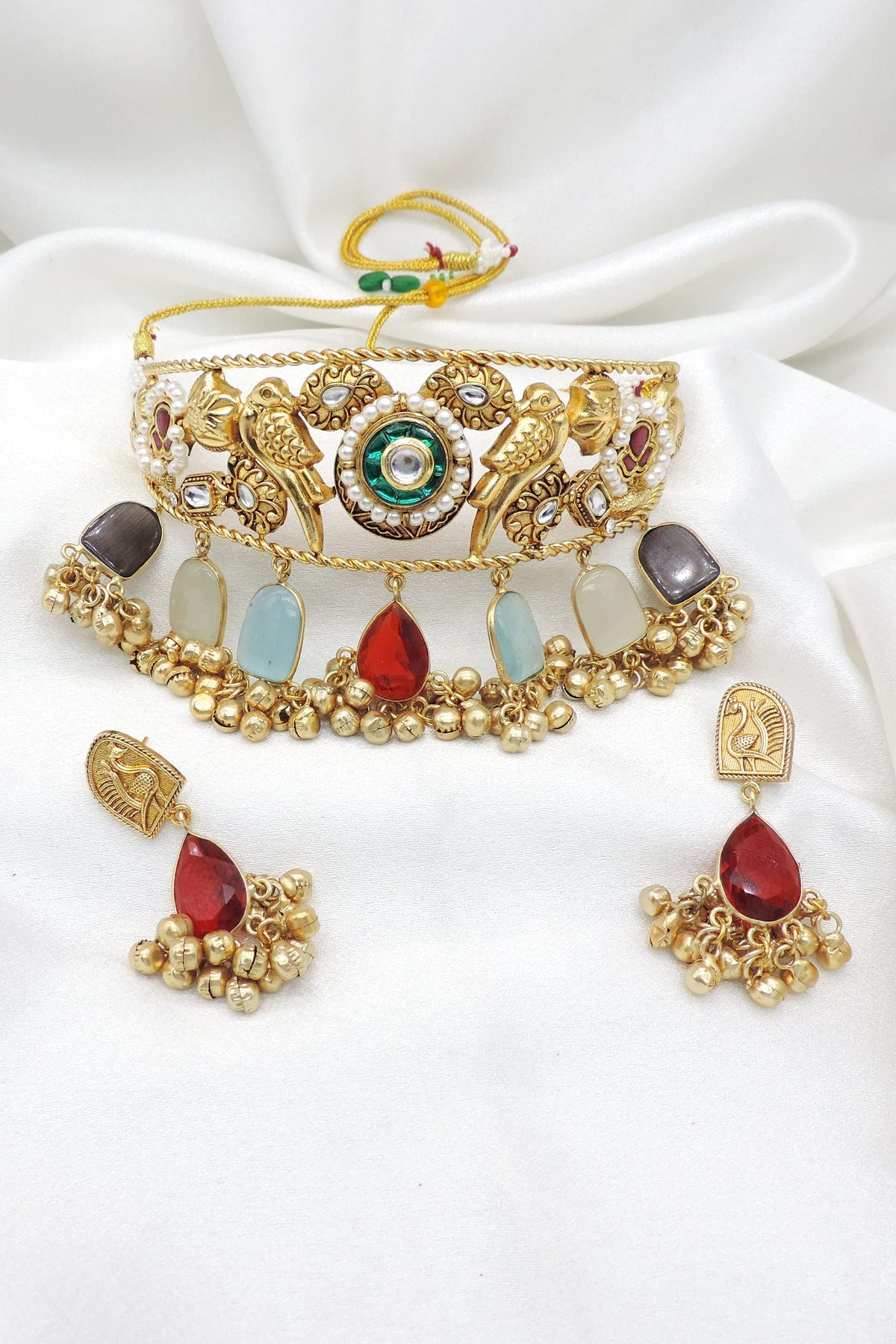 Gold-toned peacock stone pearl choker set with matching earrings by Joyrias