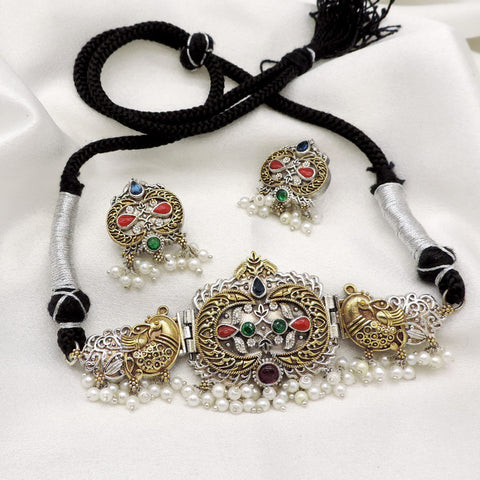 Oxidized dual-tone peacock pearl choker set with colorful stone detailing and matching earrings by joyrias