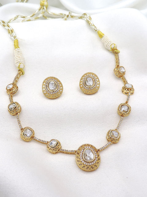 Gold-toned white stone necklace set with pearl detailing and matching earrings by joyrias