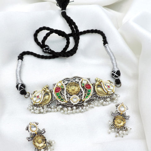 Oxidized dual-tone peacock floral kundan choker set with colorful stones and pearl detailing by joyrias