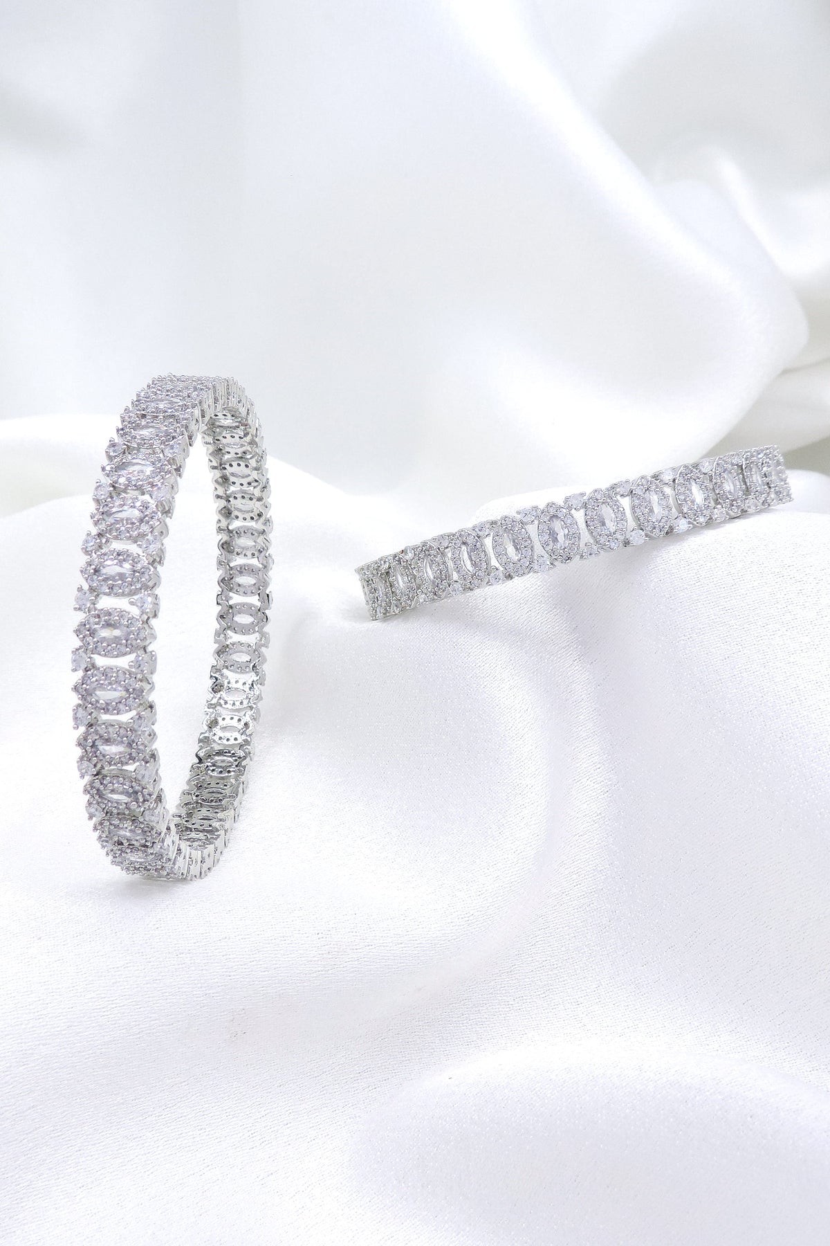 Majestic silver-toned AD bangle set with intricate linked design by joyrias