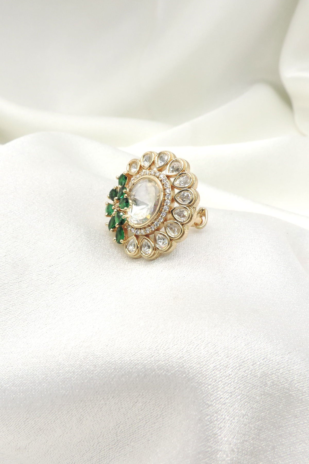 Emerald kundan floral ring by Joyrias
