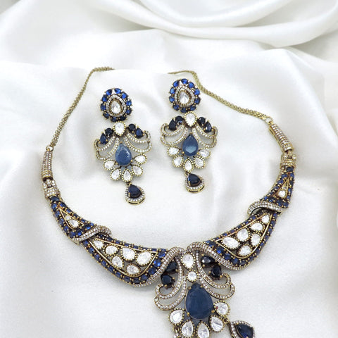 Gold-plated royal blue kundan choker set with matching earrings by joyrias