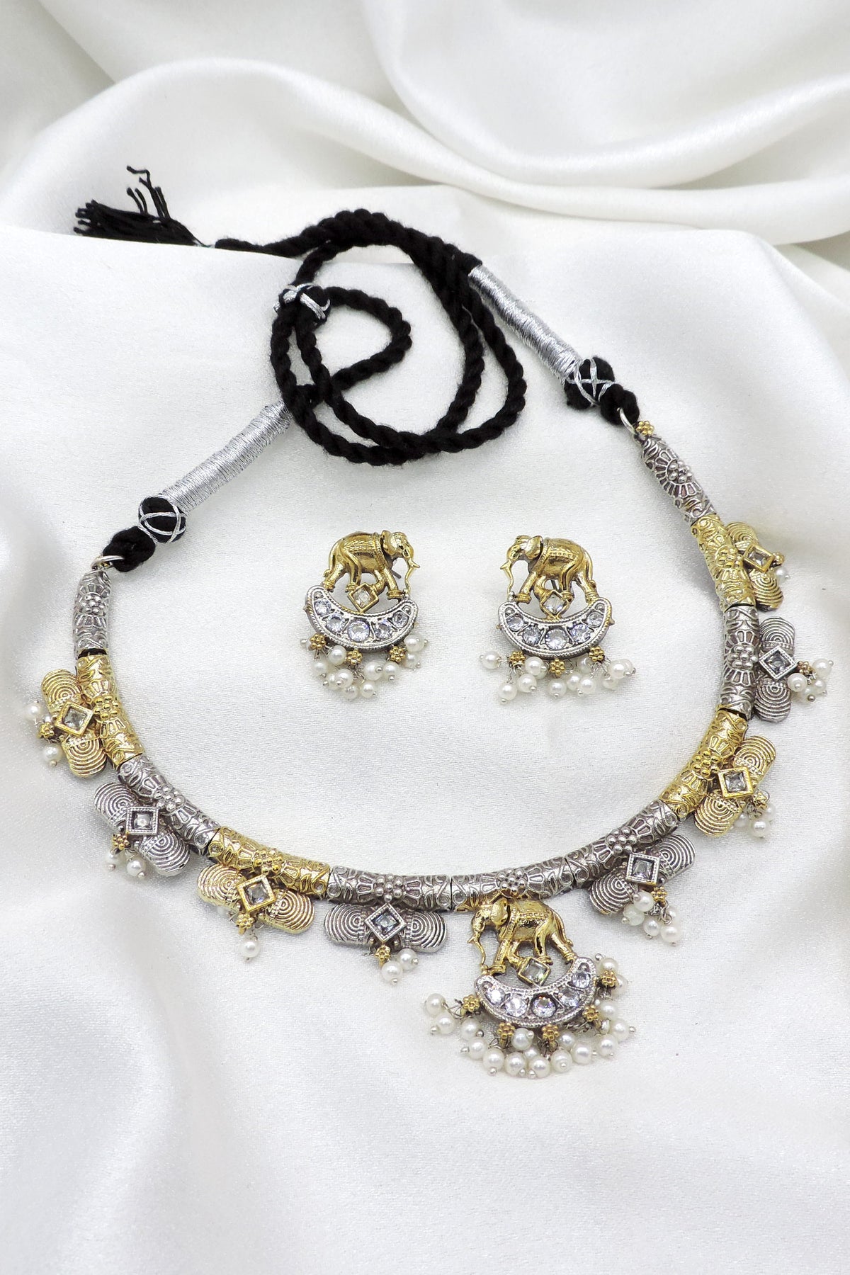 Oxidized dual-tone elephant pearl necklace set with matching earrings by Joyrias