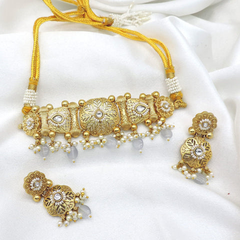 Gold tone pearl kundan choker set with matching earrings