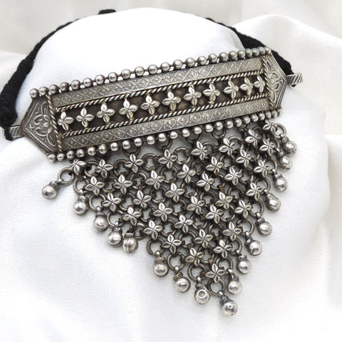 Oxidized floral cascading choker with intricate flower detailing and hanging accents by joyrias