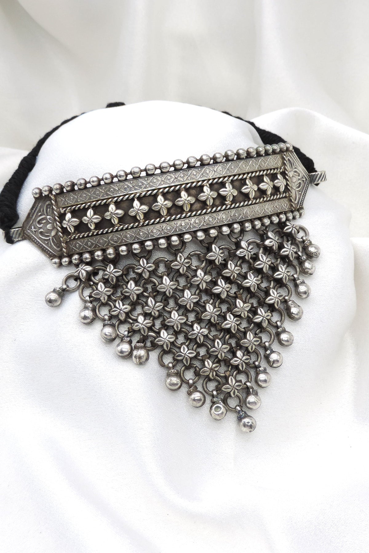 Oxidized floral cascading choker with intricate flower detailing and hanging accents by joyrias
