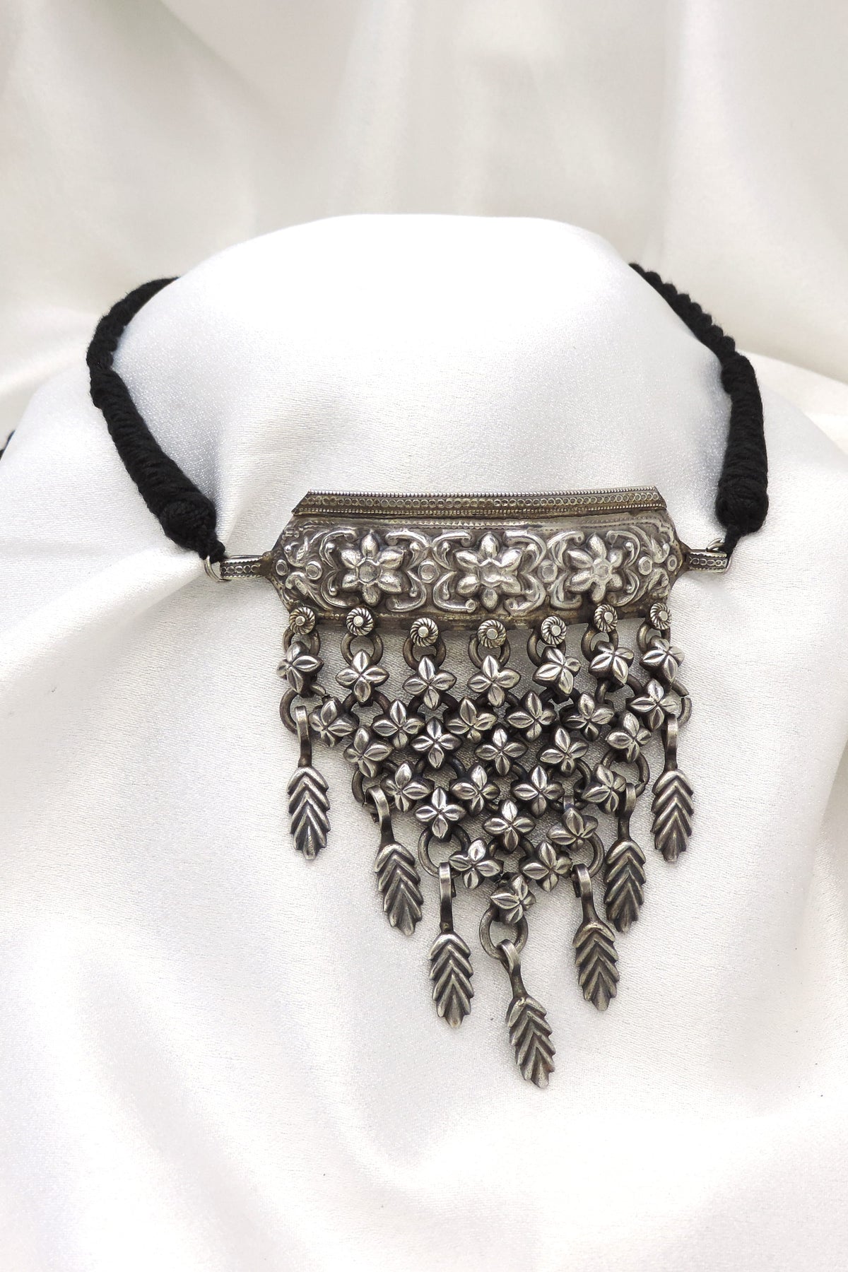 Oxidized floral cascading choker with intricate floral detailing by joyrias