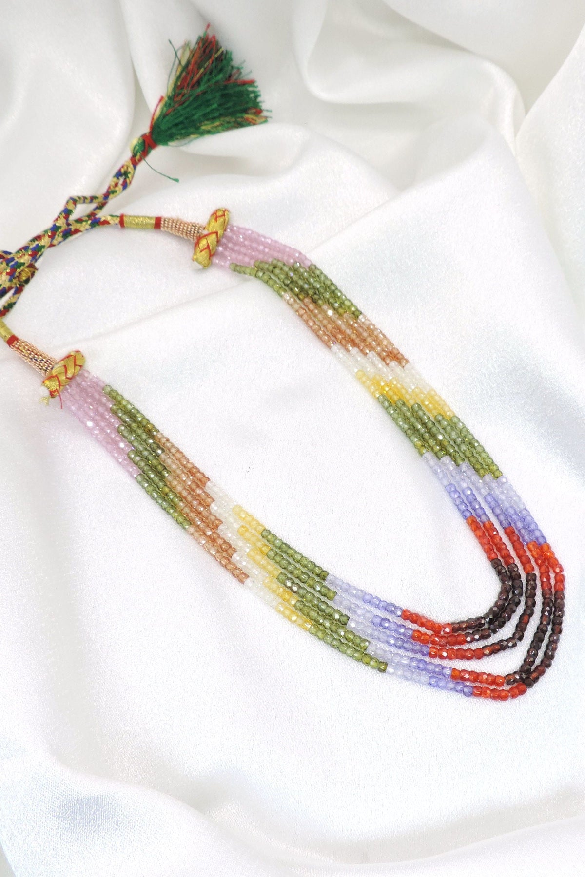 Pastel rainbow layered beaded necklace with boho tassel detailing