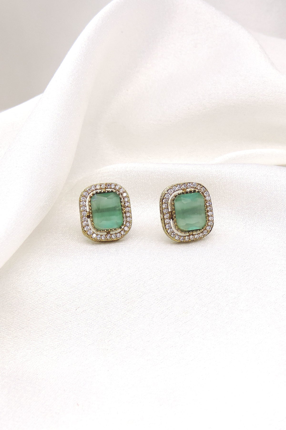 Graceful green stone rectangular stud earrings with gold-toned detailing by joyrias