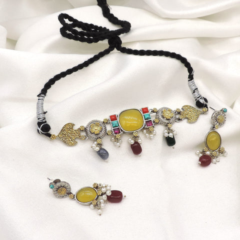 Oxidized dual tone kundan choker set with colorful stones and pearl detailing by joyrias