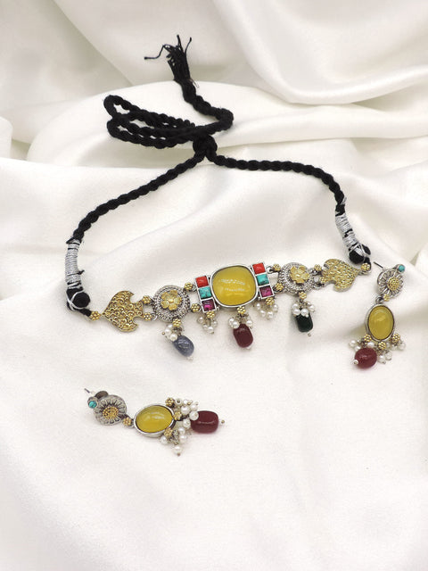 Oxidized dual tone kundan choker set with colorful stones and pearl detailing by joyrias